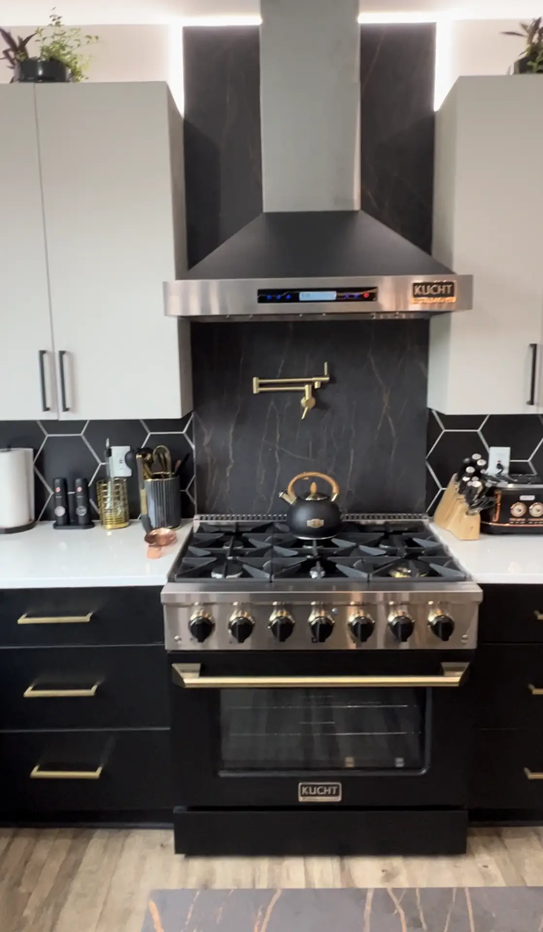 Kitchen renovation with Dekton-style surfaces and modern lighting