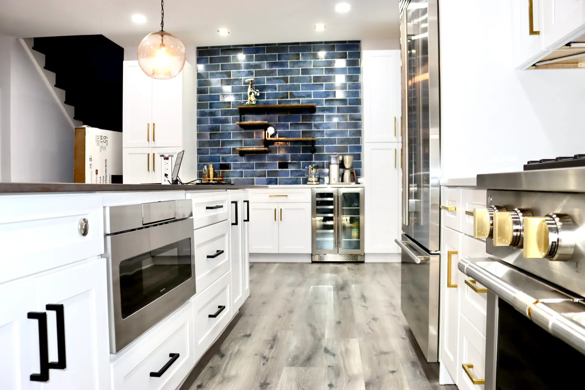 Modern kitchen renovation in Warrenton, VA featuring a large island, quartz countertops, and custom cabinetry by MSH Renovations