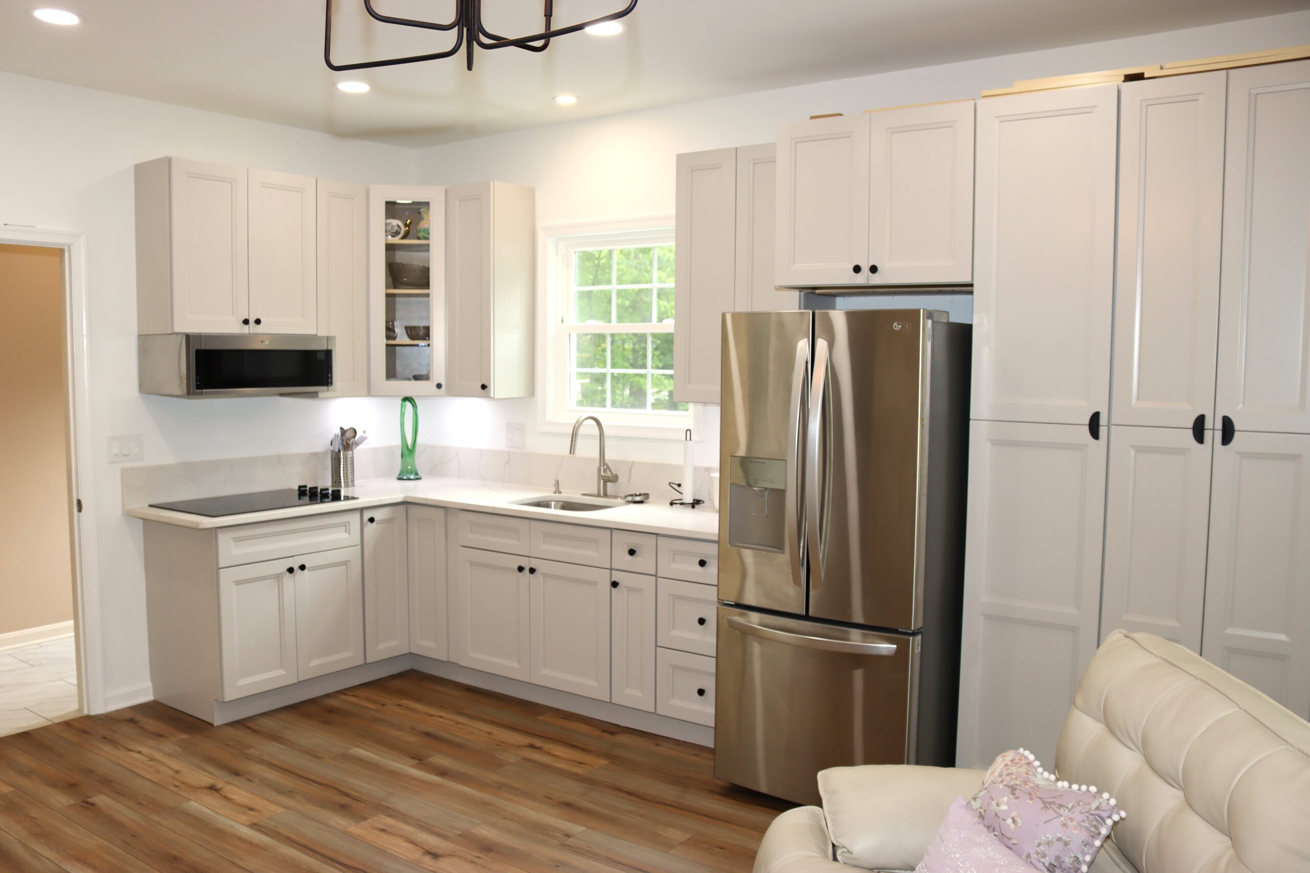 Garage conversion showing wall finishes and lighting