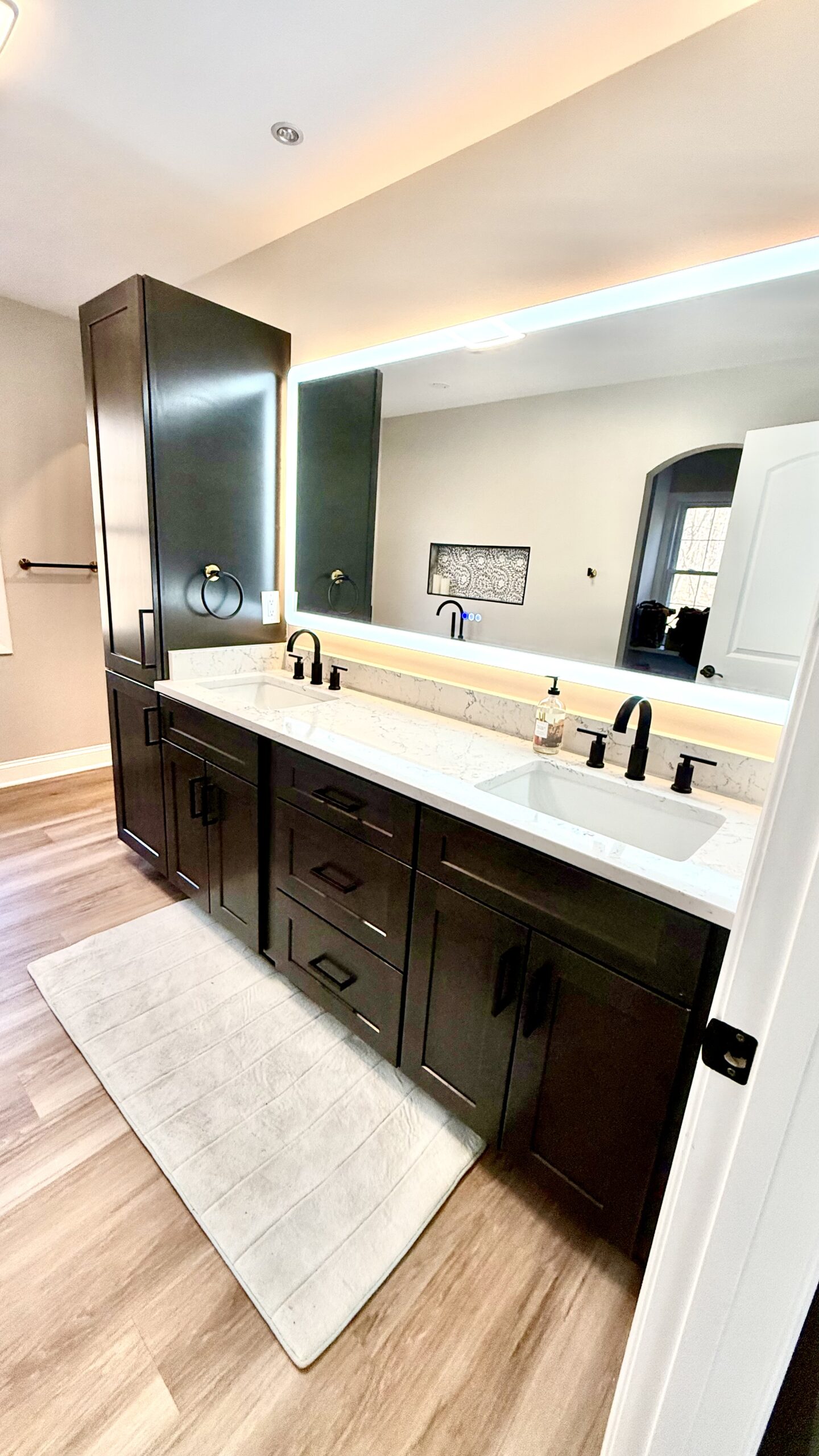 Full home renovation living area with warm neutral palette and modern furnishings