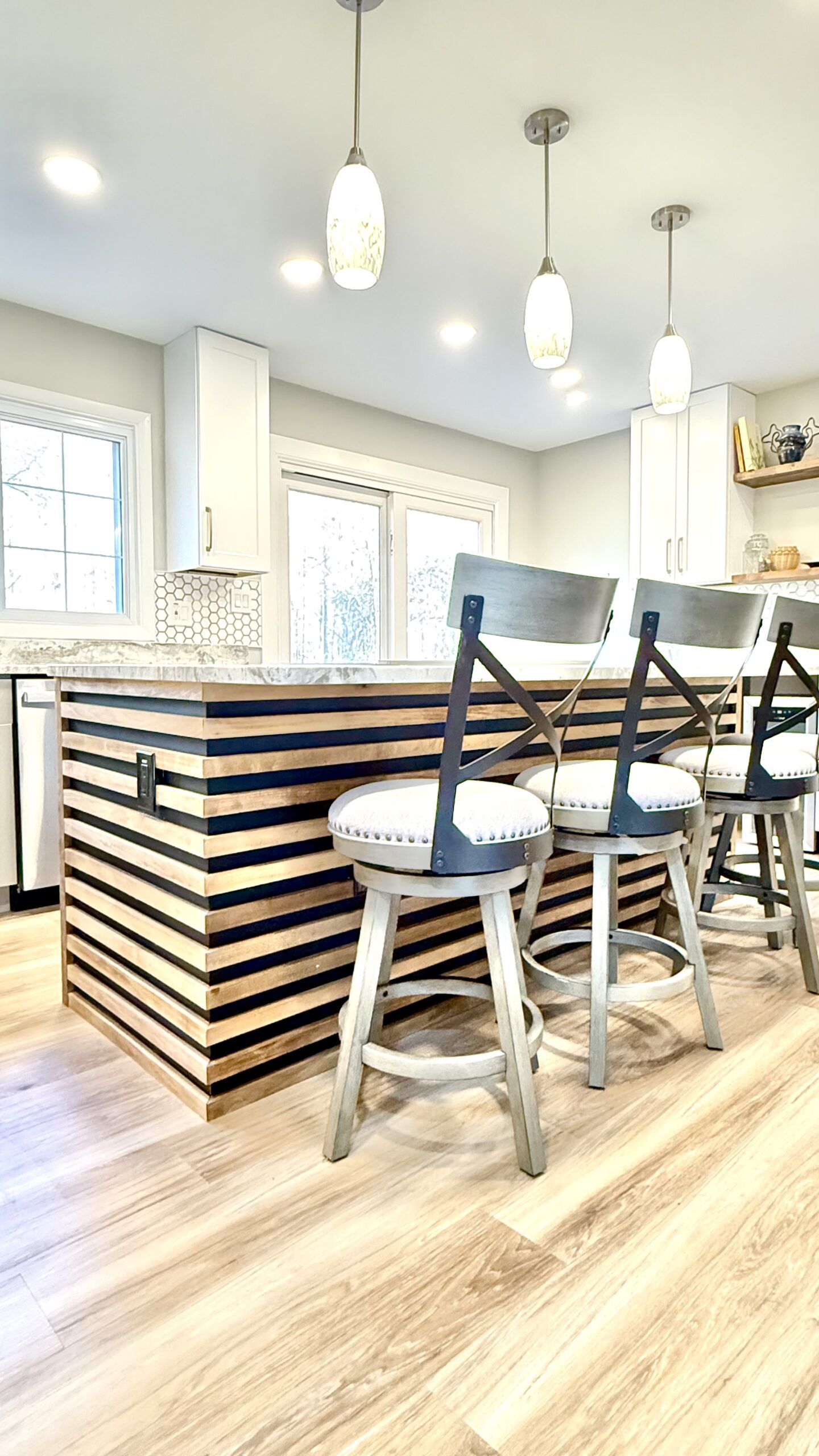 Kitchen detail showing layered lighting and rich textures