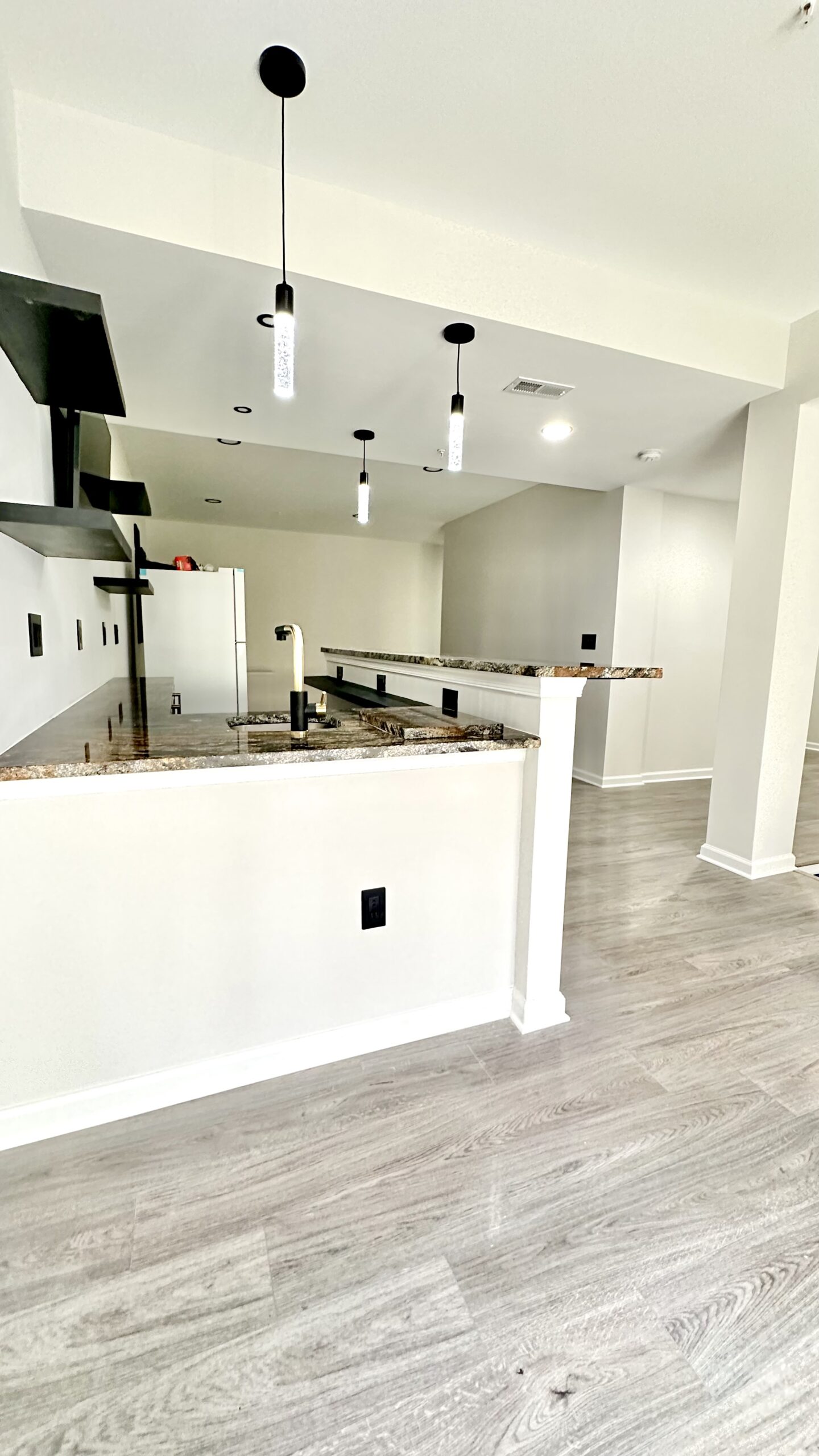 Finished basement living area with warm modern design