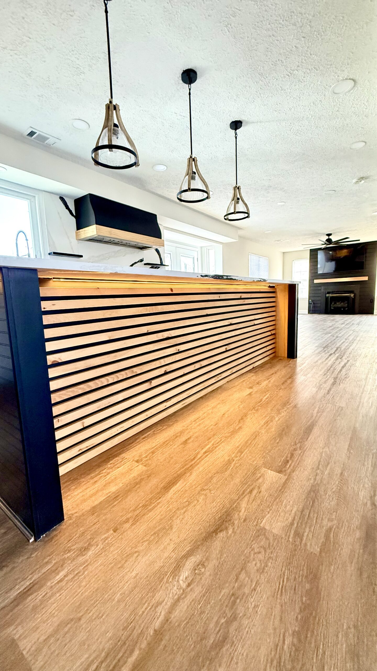 Living area updated with new flooring and lighting