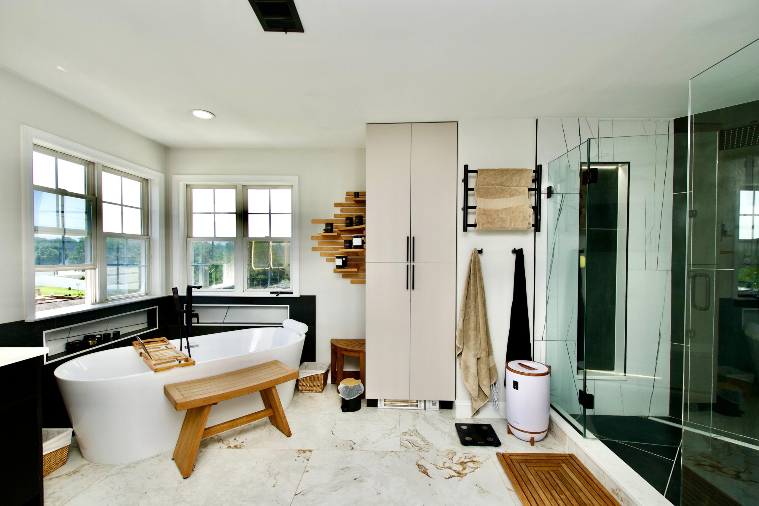 Freestanding tub and modern finishes in a luxury bathroom renovation