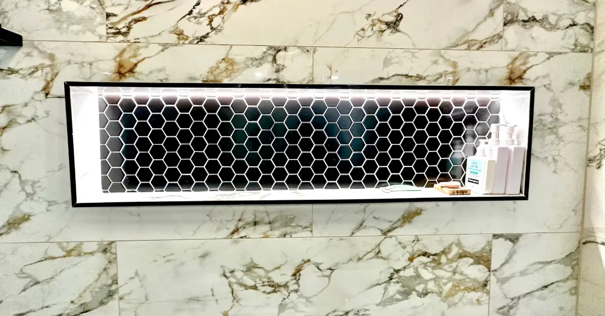 Illuminated shower niche with hex tile by MSH