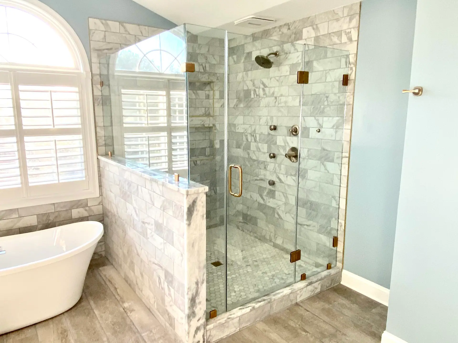 Walk in shower with marble format tile in Gainesville VA bathroom renovation